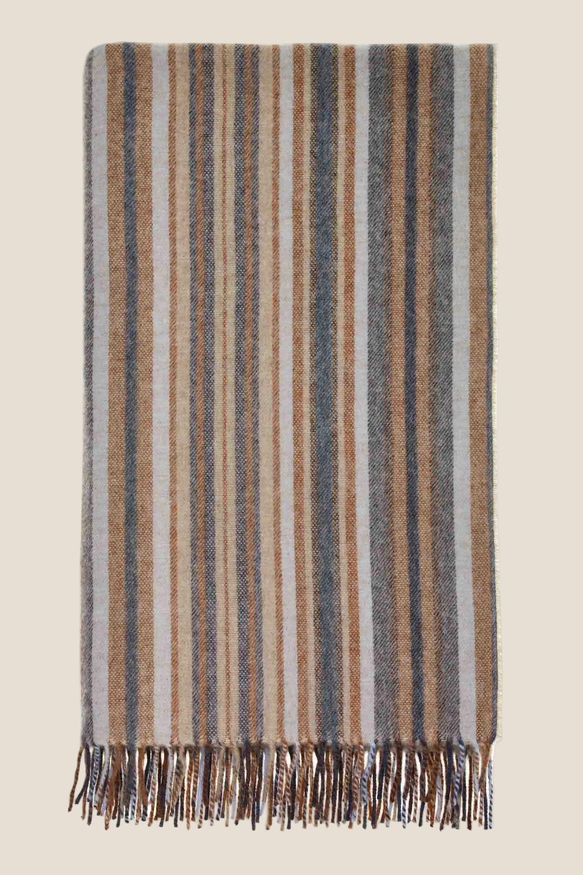 Striped blanket with fringes on a white background