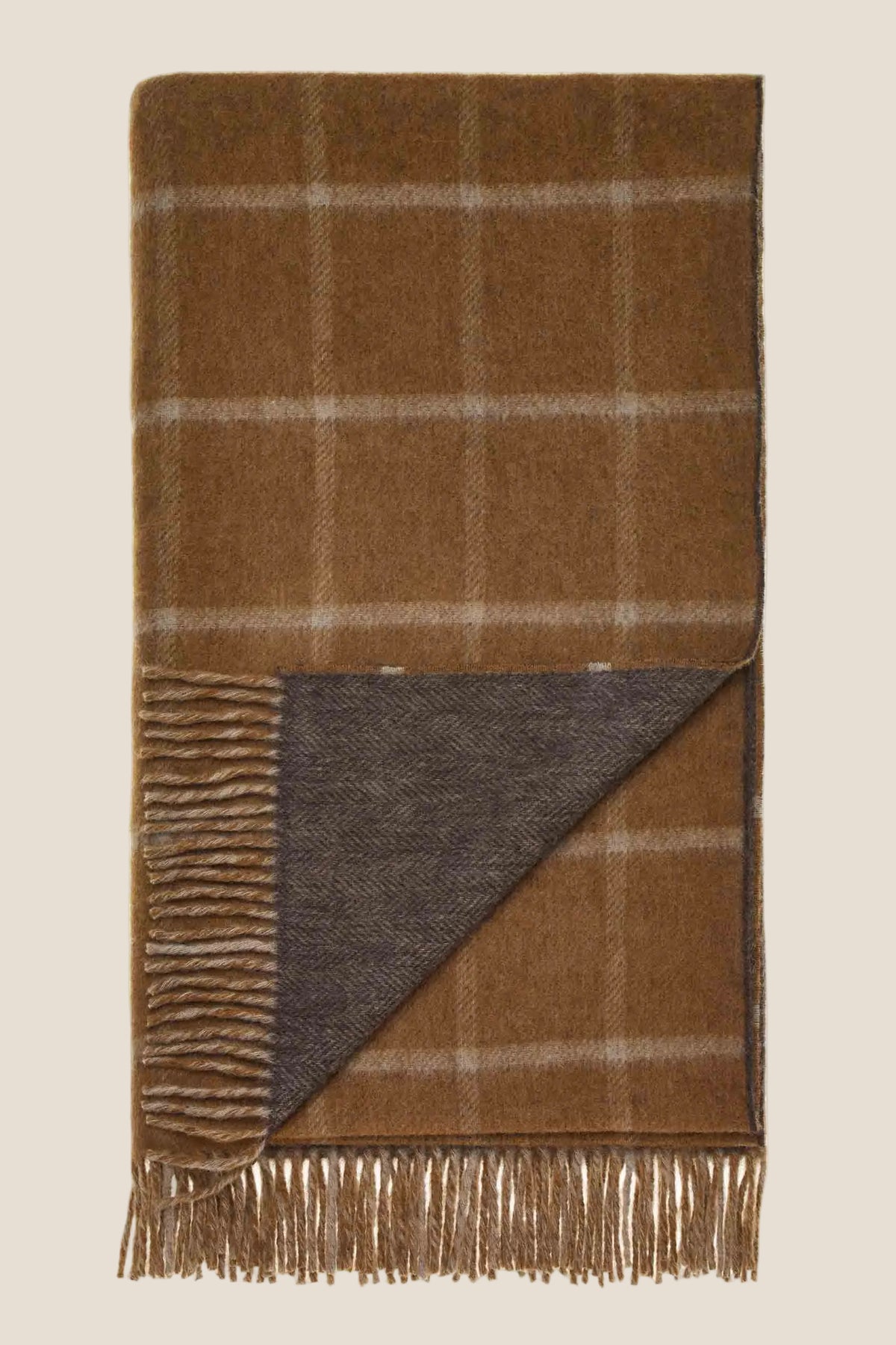 Brown plaid blanket with fringes on a white background