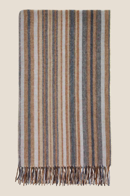 Striped blanket with fringes on a white background