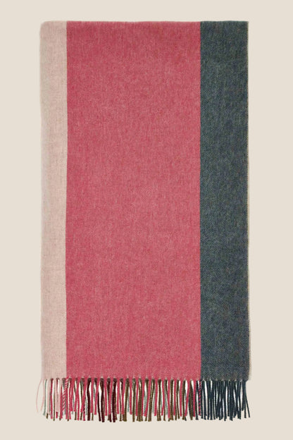 Multicolored striped scarf with fringes on a white background