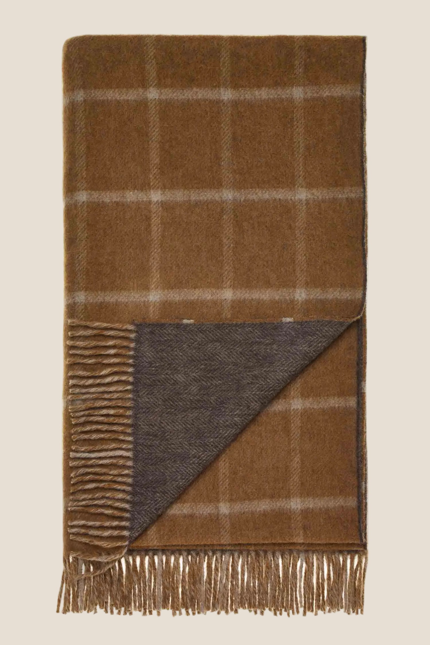 Brown plaid blanket with fringes on a white background